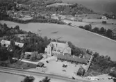 Flygfoto över Gyllene Uttern i Gränna.  Nr R 626.