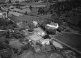 Flygfoto över Ölmstads kyrka i Jönköpings kommun.  Nr R 625.