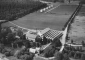 Flygfoto över Forshedaverken i Forsheda, Värnamo kommun, Jönköpings län. Nr 224/1956