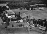 Flygfoto över Barkeryds kyrka i Nässjö kommun, Jönköpings län.  Nr: 1198/1957