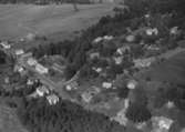 Flygfoto över Smålands Farstorp i Vetlanda kommun, Jönköpings län.  Nr: 1217/1957