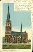 Vykort med motiv över Gustav Adolfs kyrka i Sundsvall.
