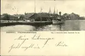 Vykort med motiv över Stockholmsbryggan och passagerartrafiken i Sundsvall.