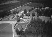 Flygfoto över Norra Hestra kyrka i Gislaved kommun, Jönköpings län. Nr 1117/1961