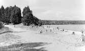 Okänd strand vid okänd sjö, 1950.