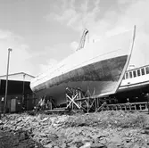 Träminsvepare utbogsering från båtskjul