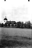 Odensvi kyrka i Köping, sedd från syd-ost.