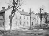 Kyrkogårdsgatan i korsningen med Gropgränd, Uppsala 1901 - 1902