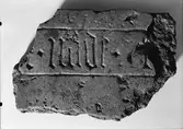 Fragment av en gravhäll, Uppsala 1946