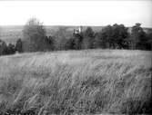 Landskapsvy med Norrsunda kyrka, Uppland 1928