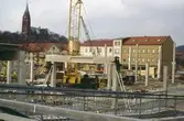 Centrumhuset under byggnation vid Frölundagatan i Mölndals centrum på 1970-talet. Vy från Mölndals Bro.