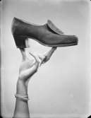 Reklamfotografering för skor
En sko i en kvinnas hand