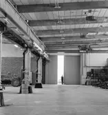 Portar
Interiör. Reservdelslager med traktorer.