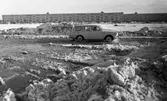 Snömodd och översvämning bland annat i Varberga 1 februari 1966

Bil i vattensamling på vintrig gata