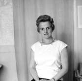 En kvinna, bröstbild.Fröken NilssonBilden tagen för pass.