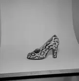 En sko.
Oscaria Skofabrik.