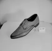 En sko.
Oscaria Skofabrik.