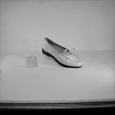 En sko.
Oscaria Skofabrik.