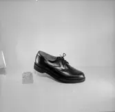 En sko.
Oscaria Skofabrik.