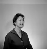 En kvinna, bröstbild.
Örebro Sparbank.