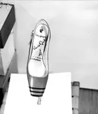 En sko.
Oscaria Skofabrik.