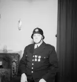 En man i uniform.
Fredelius