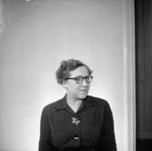 En kvinna, bröstbild.Gustafsson & Görtz personal.