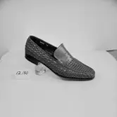 En sko.
Oscaria Skofabrik.