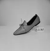 En sko.
Oscaria Skofabrik.