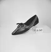 En sko.
Oscaria Skofabrik.