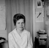 En kvinna.Fröken MacekBilden tagen för pass.