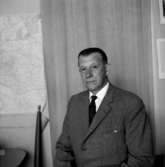 En man, bröstbild.KarlssonBilden tagen för pass.