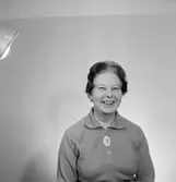 En kvinna, bröstbild.
Örebro Sparbank.