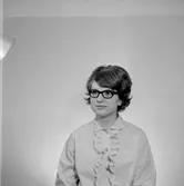 En kvinna, bröstbild.
Örebro Sparbank.