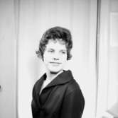 En kvinna, bröstbild.Christina