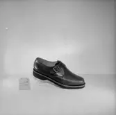 En sko.
Oscaria Skofabrik.