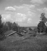 Bostadshus och byggnader.
25 juni 1958.