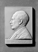 Plakett föreställande Upsala Ångqvarn AB:s ledare H. W. Söderman - huvud i relief av Tore Strindberg