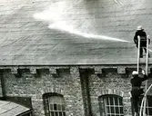 Brandskyddövning på Papyrus. Två okända brandmän.