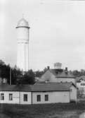 Vattentornet med elektricitetsverket till höger, i förgrunden Lundins gård, Östhammar, Uppland