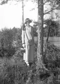Kvinna. Tidsomfånget är 1900 - 1940