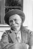 Kvinna. Tidsomfånget är 1900 - 1940