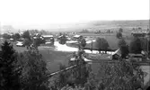 Vy över Åbyn, taget från Hamrångekyrkan. Kyrkoherdeboställets uthus längst ner till höger.