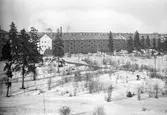 Stadvy över nybyggda fastigheter i korsningen Väpnargatan/Hillmansgatan, Brynäs, 1948.