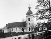 Valbo kyrka är Gästriklands äldsta kyrka. Genom den uppländske runristaren Åsmund Kåressons runstenar i östra Gästrikland att där fanns kristna i mitten av 1000-talet och att en kyrka i trä uppförts under 1000-talet. Området där kyrkan står heter Torsvallen platsen kan ha hyst ett tempel helgat åt asaguden Tor. Resterna av en stenkyrka, en absidkyrka återfinns under den nuvarande kyrkan, är från 1100-talet och daterades vid restaurering 1955-1956. Den nuvarande kyrkan började byggas är oklart. Enligt museiintendent O. Källström uppfördes den under 1300-talet senare hälft, medan docent B. I. Kihlström menar att kyrkan påbörjades i slutet av 1200-talet. Från denna period kvarstår koret och den östligaste delen av långhuset. Riksantikvarieämbetets register anger att långhuset är uppfört under perioden 1150–1199 och ut- och tillbyggt med kor under perioden 1270–1329. Förutom högaltaret hade kyrkan två sidoaltare, det södra helgat åt Johannes Döparen, till vars ära kyrkan invigts och det norra sannolikt till Maria. Under 1700-talet byggdes kyrkan ut med sakristia 1736, ytterligare ett valvkvarter 1742–1743 och ett torn 1776–1777, arkitekt Olof Tempelman till vilket kyrkklockorna flyttades från den tidigare fristående klockstapeln.
