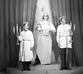 Lucia med påhäng. 13 december 1944. Firma Carl Larsson, Gävle.