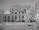 Tuna gård på vintern.