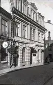 Tanneforsgatan, Café Tomten, Pehr Pettersson Tapetserare, C. E. Hammers Eftr. Läderhandel och A. Wallins Eftr. Ur & Optiska Affär.