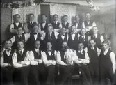 Gruppbild av 22 män.