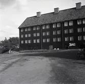 Arbetarkasern i inpanelat korsvirke.